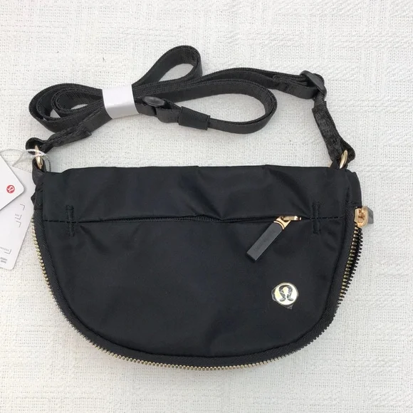 lululemon athletica Black Crossbody Bag with Gold Accents 2L - Picture 1 of 4